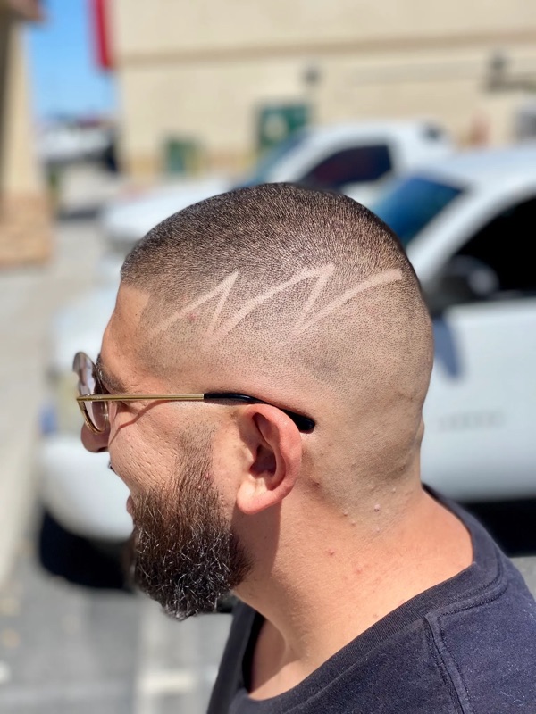 Bald fade with lightning design