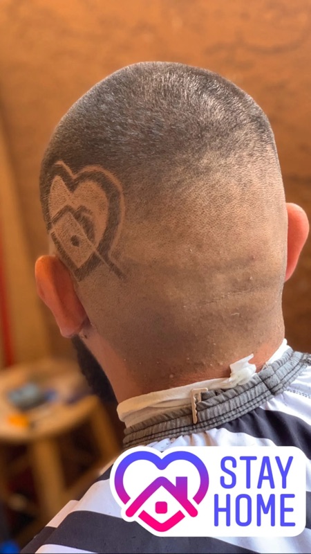 Skin fade with heart design, back view